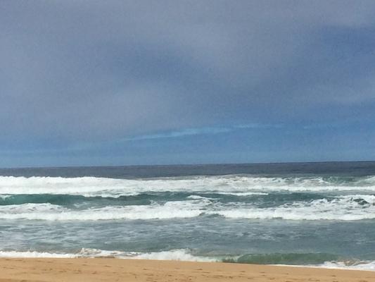 Kekaha Beach on West Kauai... the view to the south... with endless waves coming from the Pacific Ocean... it's a great beach... seldom crowded... excellent for tanning or walking, reading or meditation...