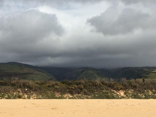 Kekaha Beach on the West side of Kauai, looking to the north up into the foothills of Kokeè...low clouds bring much needed rain to this side of the Garden Island... 