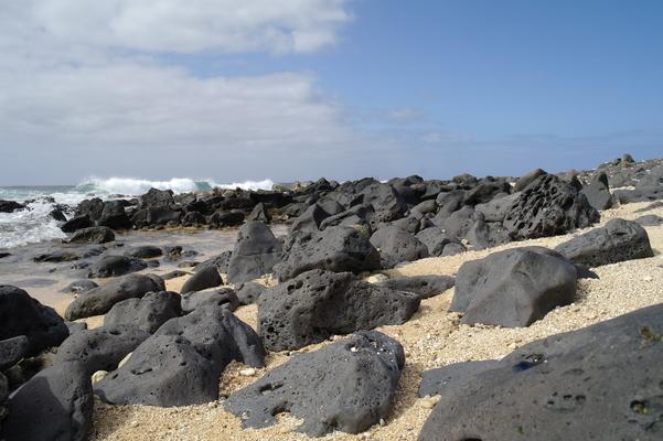 Salt Pond Beach a little further east... black volcanic rocks buried in the sand and warming in the sun... 