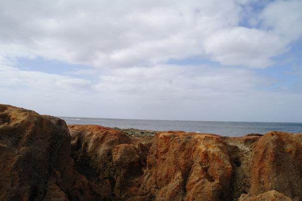 Salt Pond Beach on the Eastern edge of the beach. Volcanic rocks that are constantly being worn down by endless waves breaking on them when the tide is up and the swell brings in waves. An excellent location for tidal pools... good for exploring.