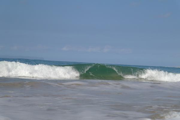 Kekaha Beach with beautiful glassy waves... the sound is comforting and the waves mesmerizing as the the break wave after wave, set after set... Kekaha Beach on the drier West side of  Kauai is almost always sunny and hot... 