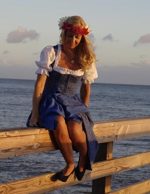 fesches blue Lanz Dirndl ,traditional costume from Austria with plumeria flower haku lei red and yellow 