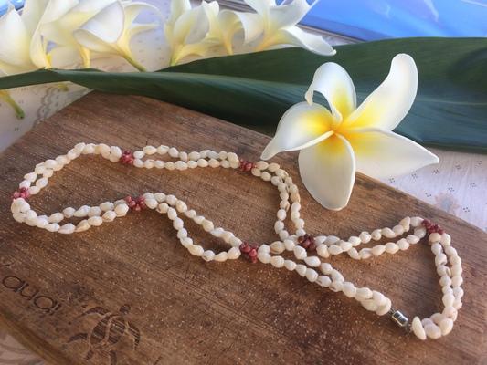 Niʻihau Lei Making: The Art of Shell Lei (Lei Pūpū Niʻihau)

Niʻihau lei making is a highly specialized and treasured Hawaiian tradition, unique to the island of Niʻihau. Unlike most Hawaiian leis, which are made from flowers, Niʻihau leis are crafted using rare and valuable shells, making them some of the most sought-after and expensive leis in the world.

1. The Unique Niʻihau Shells

The shells used in Niʻihau leis are called pūpū (shells) and are found exclusively on the shores of Niʻihau and parts of Kauaʻi. These shells are meticulously handpicked, cleaned, sorted, and strung to create intricate patterns.

Types of Niʻihau Shells:
	•	Kahelelani – The smallest and most valuable, found in colors like white, pink, red, yellow, and brown.
	•	Momi – Smooth, rounded shells, usually white, beige, or golden.
	•	Laiki (Rice Shells) – Tiny, rice-shaped shells often used as accents.
	•	Kāmoa – A rarer type of shell, usually brownish or golden.

The color, luster, and rarity of the shells determine the value of the lei. Some shells are so rare that a single lei can take years to complete.

2. The Process of Lei Making

Step 1: Gathering Shells
	•	Niʻihau residents carefully collect the shells by hand along the island’s beaches.
	•	Shells are only collected when they naturally wash ashore, ensuring sustainability.

Step 2: Cleaning and Sorting
	•	Shells are soaked, cleaned, and sorted by size, shape, and color.
	•	Only the highest-quality shells are selected for the lei.

Step 3: Drilling and Stringing
	•	Each shell is hand-drilled using traditional techniques, often with a fine needle.
	•	Shells are strung in intricate patterns, using different styles such as:
	•	Heli (Twisted)
	•	Poepoe (Round)
	•	Pikake (Resembling Jasmine Buds)
	•	Wili (Spiraled)

3. Cultural and Economic Importance
	•	Cultural Significance: Lei pūpū Niʻihau are considered sacred and prestigious in Hawaiian culture, often worn at special ceremonies, weddings, and hula performances.
	•	Economic Livelihood: Lei-making is a primary source of income for many Niʻihau residents, as the island has limited resources and tourism is restricted.
	•	Legal Protection: Under Hawaiian law, a lei can only be called an authentic “Niʻihau shell lei” if 100% of the shells are from Niʻihau and the lei is strung in the traditional way by Niʻihau artisans.

4. Value and Rarity
	•	Because of their rarity and craftsmanship, authentic Niʻihau shell leis can sell for thousands of dollars.
	•	Museums, collectors, and Hawaiian cultural institutions highly prize these leis.
	•	Many Niʻihau leis are heirlooms, passed down for generations.

Conclusion

Niʻihau shell lei making is more than just an art—it is a sacred cultural practice that reflects the island’s deep connection to the land and the ocean. These one-of-a-kind treasures continue to preserve Hawaiian traditions and provide a sustainable livelihood for the people of Niʻihau.